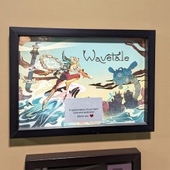 Wavetale A4 frame produced for Thunderful Games with copper hot foil printing in the artwork and a custom printed plaque