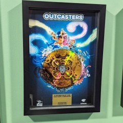 Outcasters A4 frame produced for Splash Damage with printed gold vinyl-effect disc and custom plaque